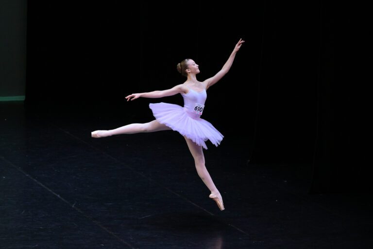 A girl doing ballet on stage